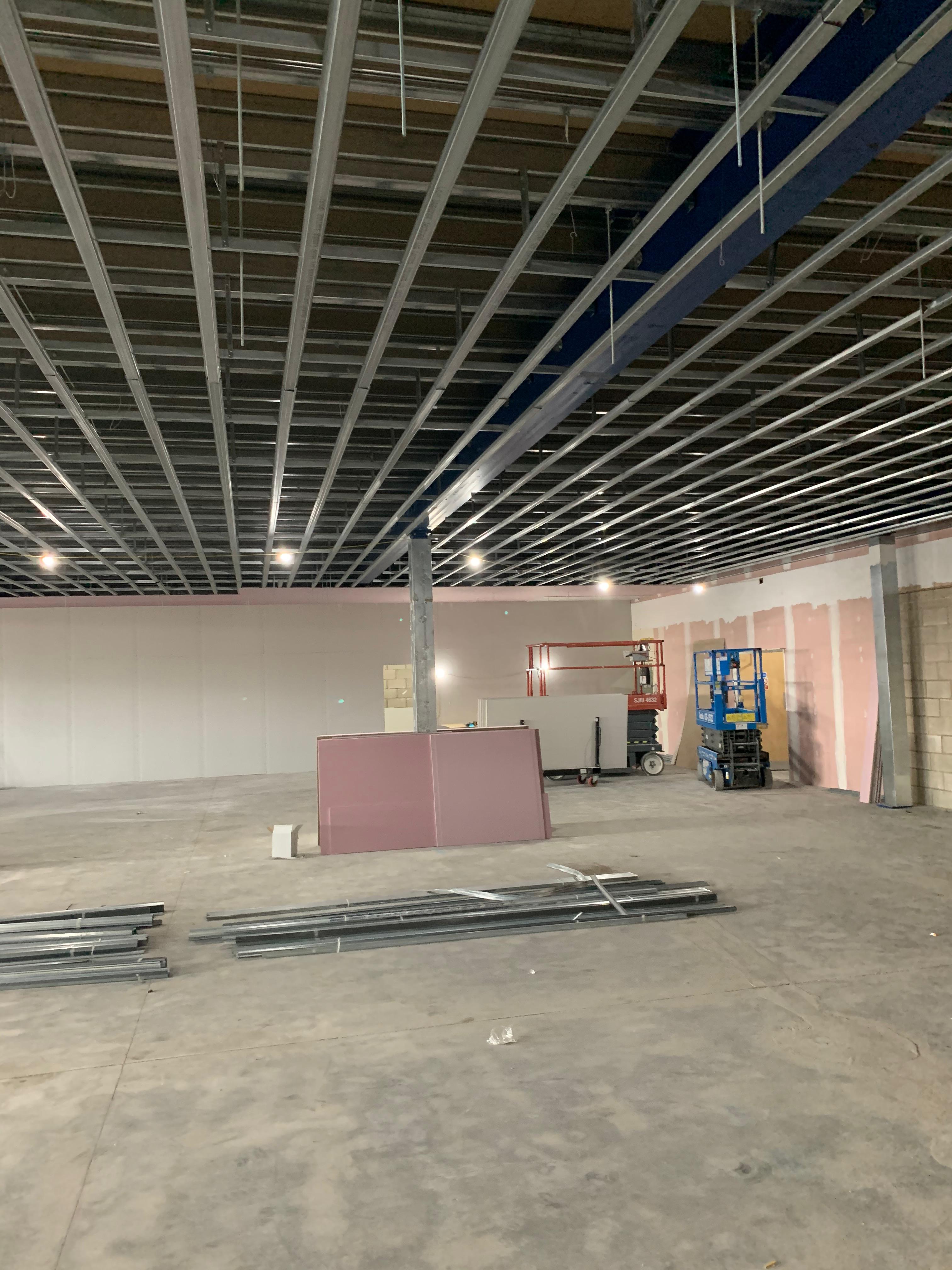 Professional metal fixing ceiling with fibreglass insulation installation